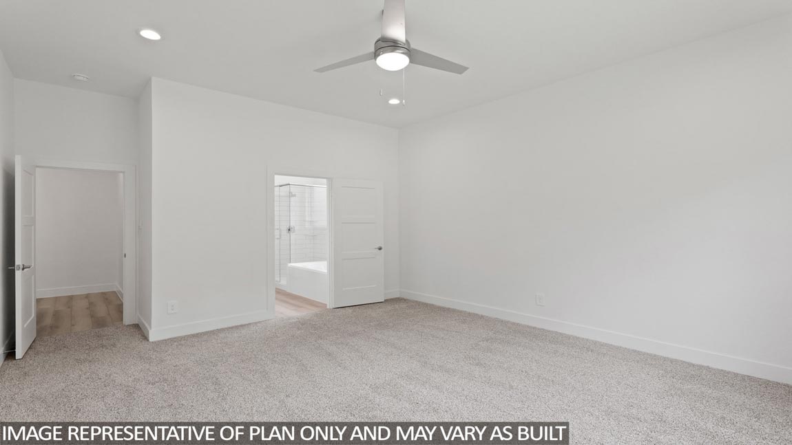 Primary bedroom with carpet flooring