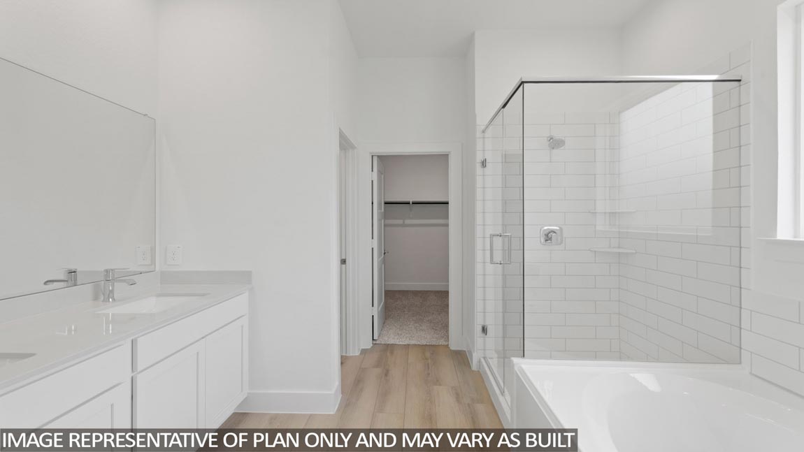 Primary bathroom with tub and shower