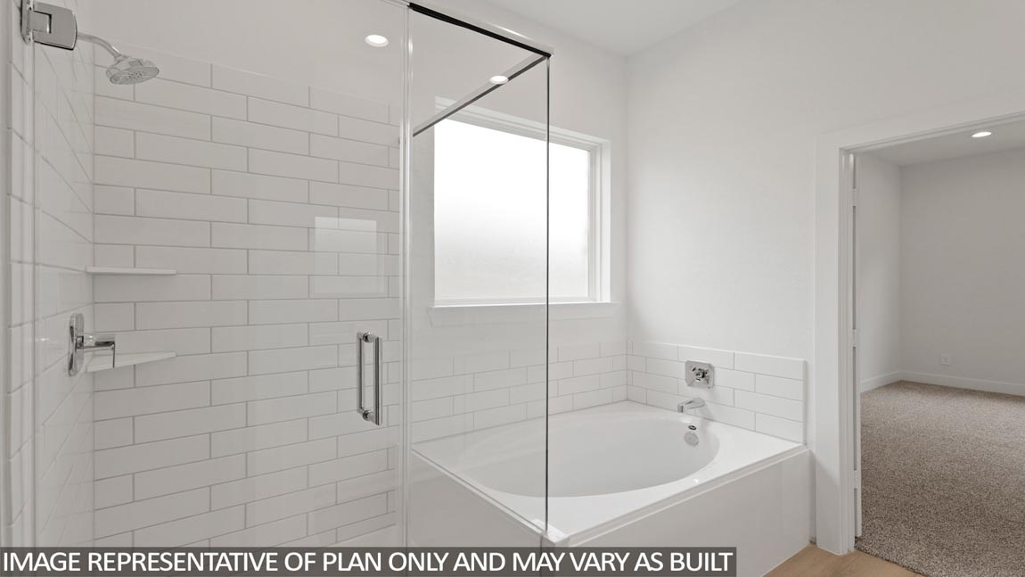 Primary bathroom with tub and shower