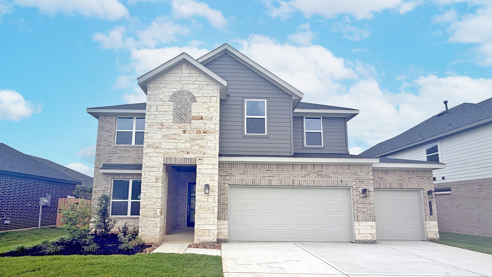 Two story home with three car garage