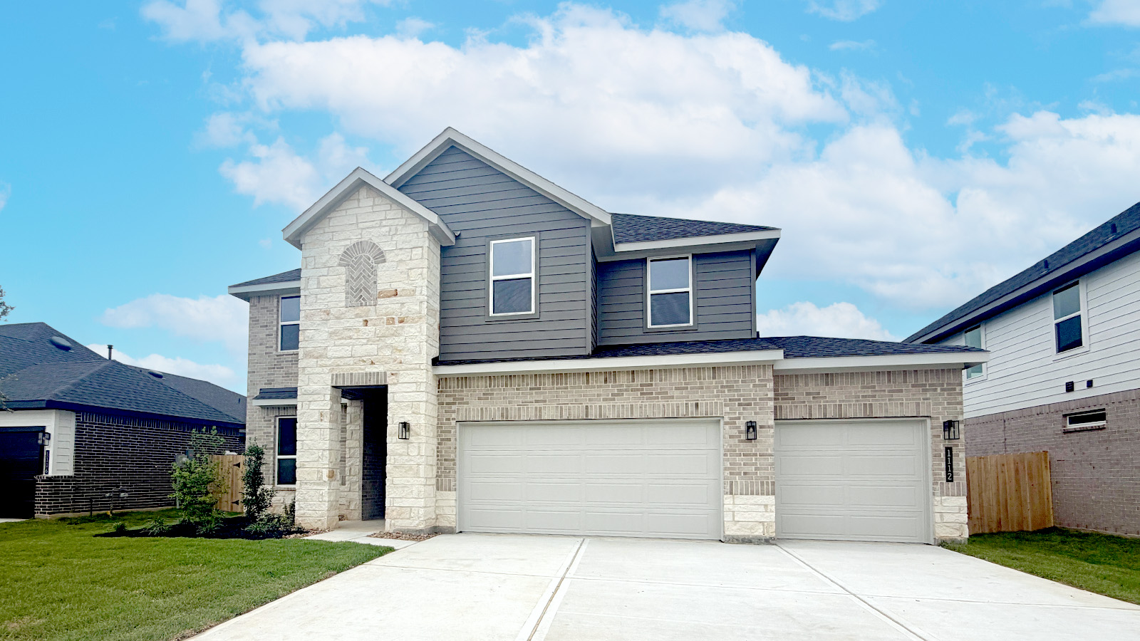 Two story home with three car garage