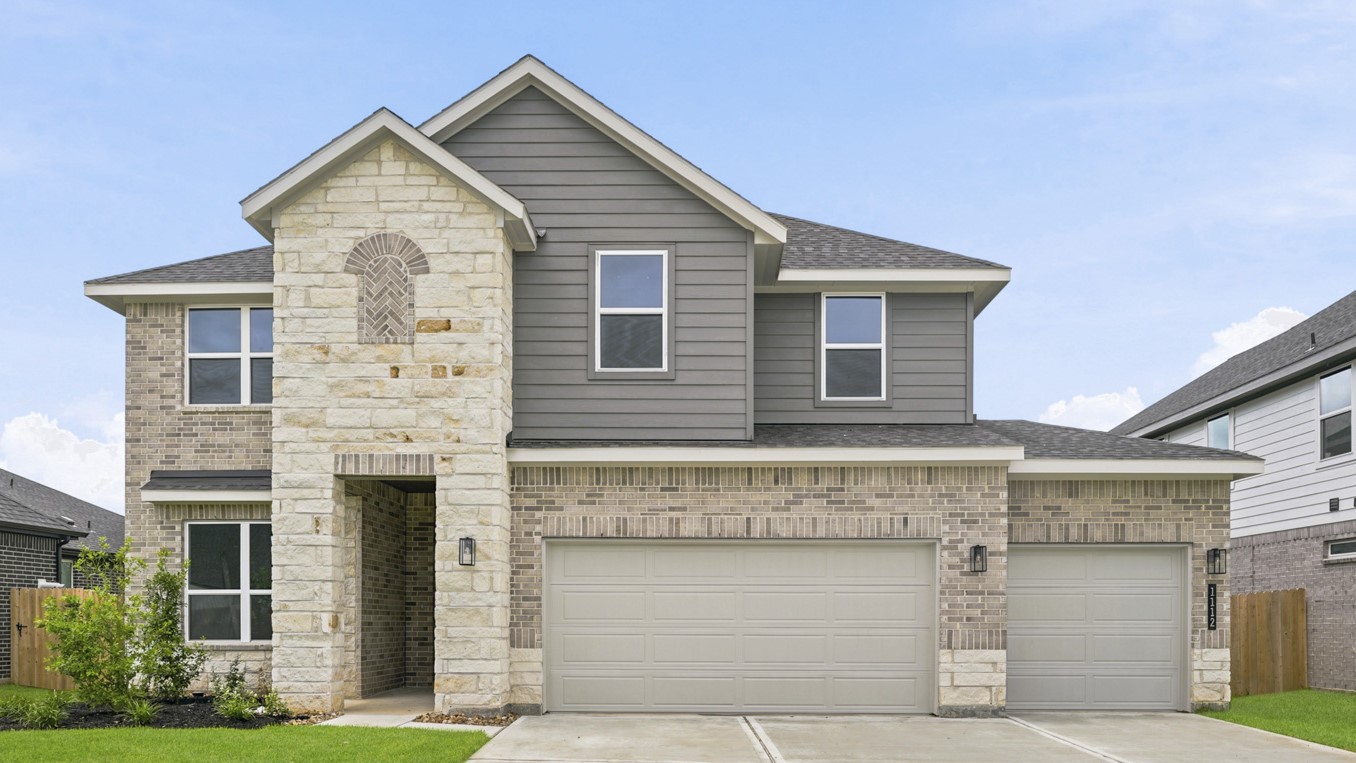 Two story home with three car garage