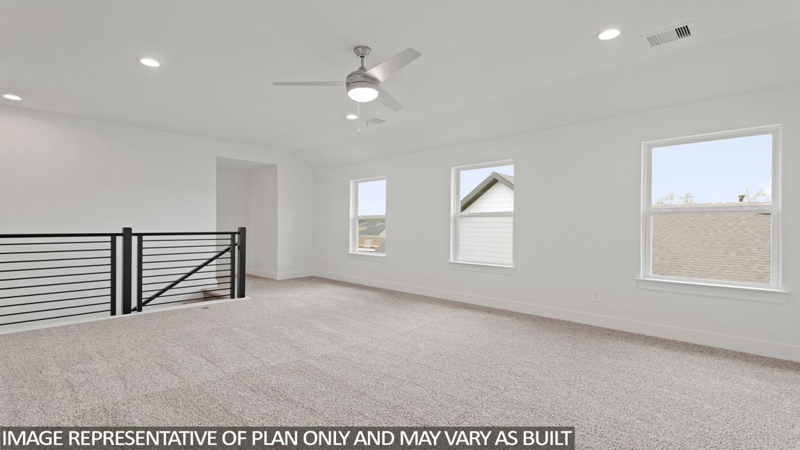 Second story game room with carpet flooring