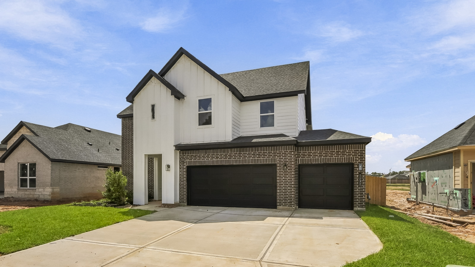 Two story home with three car garage
