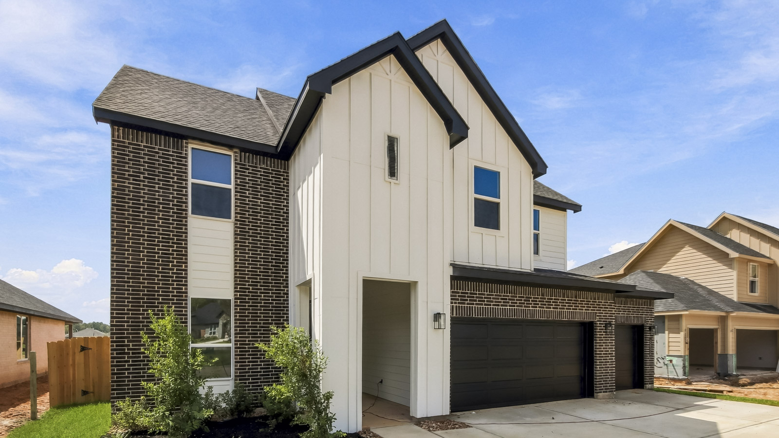 Two story home with three car garage