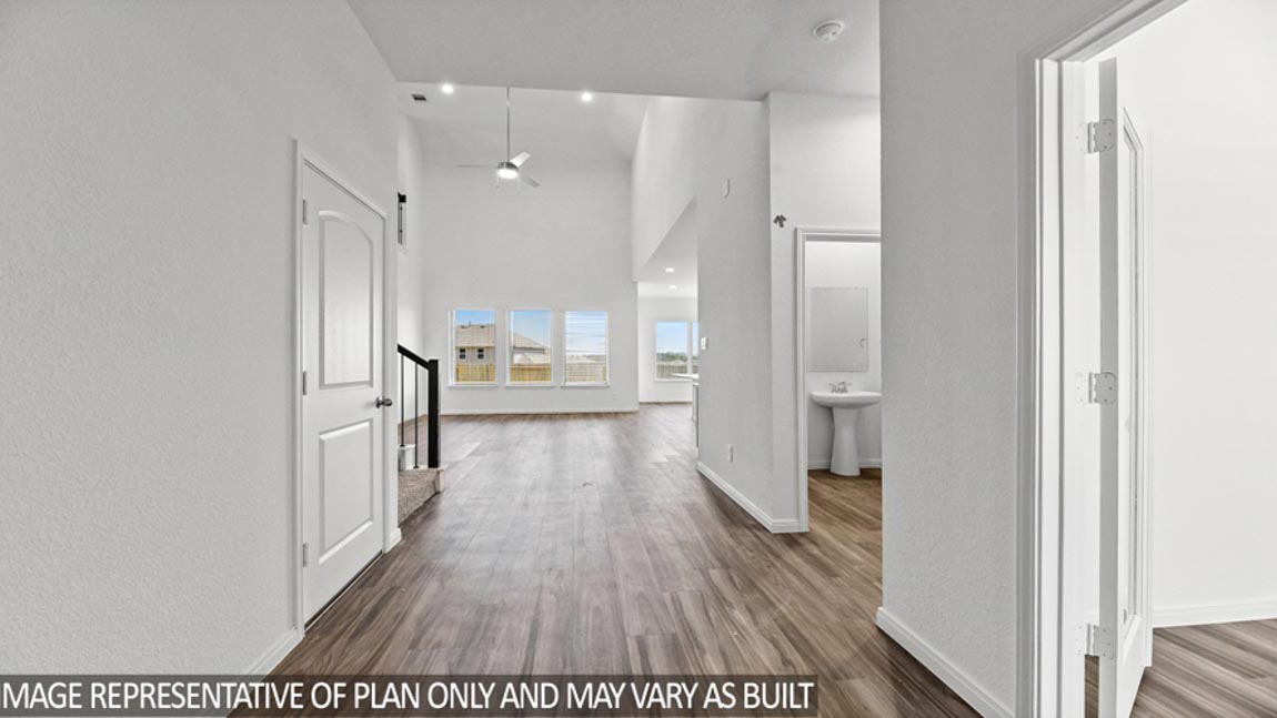 Entryway and foyer with vinyl flooring.
