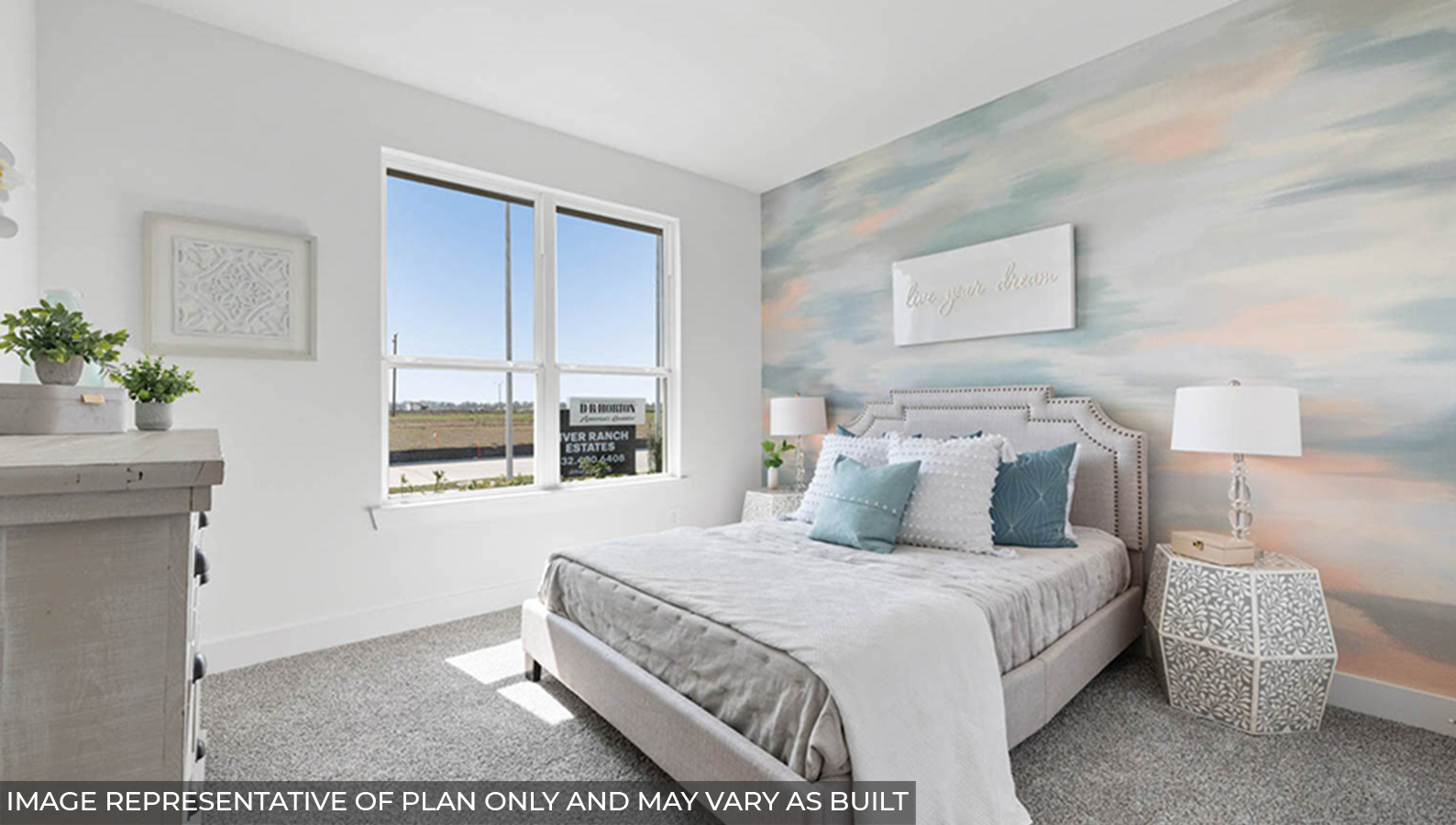 Secondary bedroom with carpet flooring