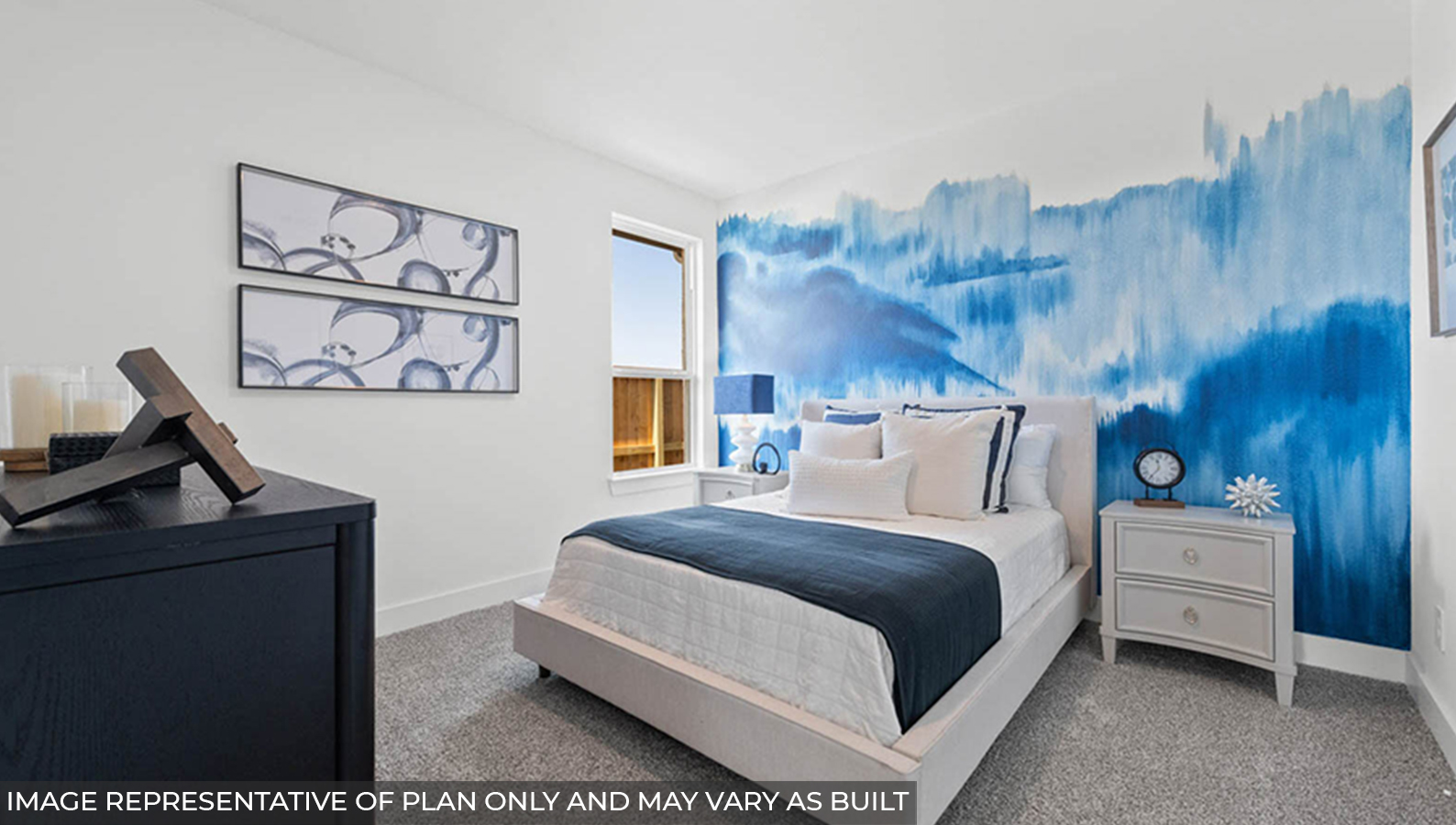Secondary bedroom with carpet flooring