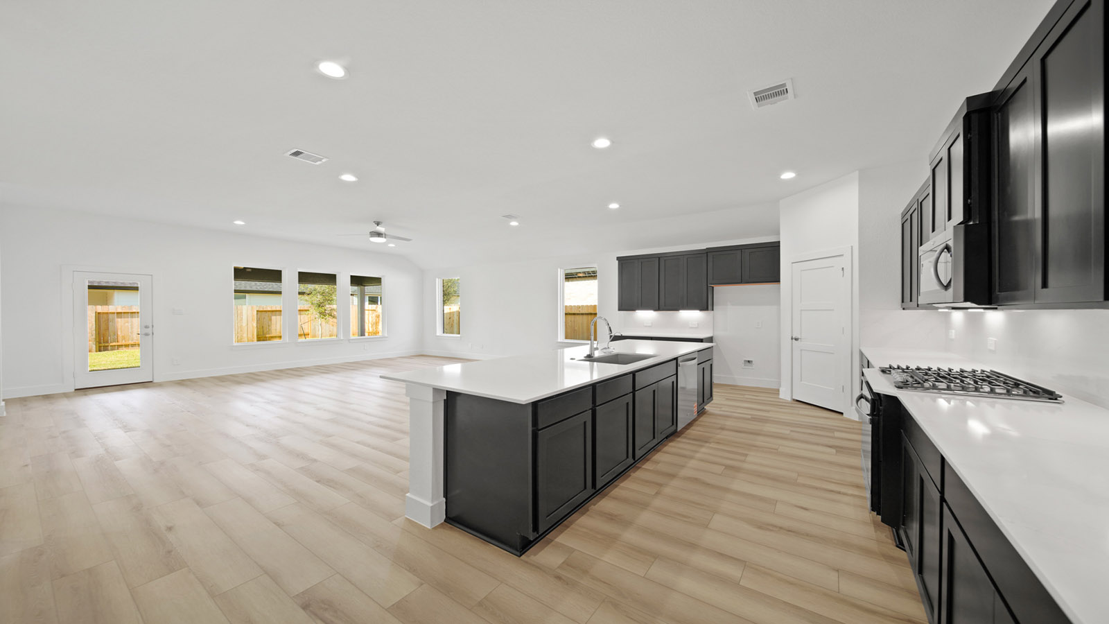 Open concept living, dining, and kitchen area