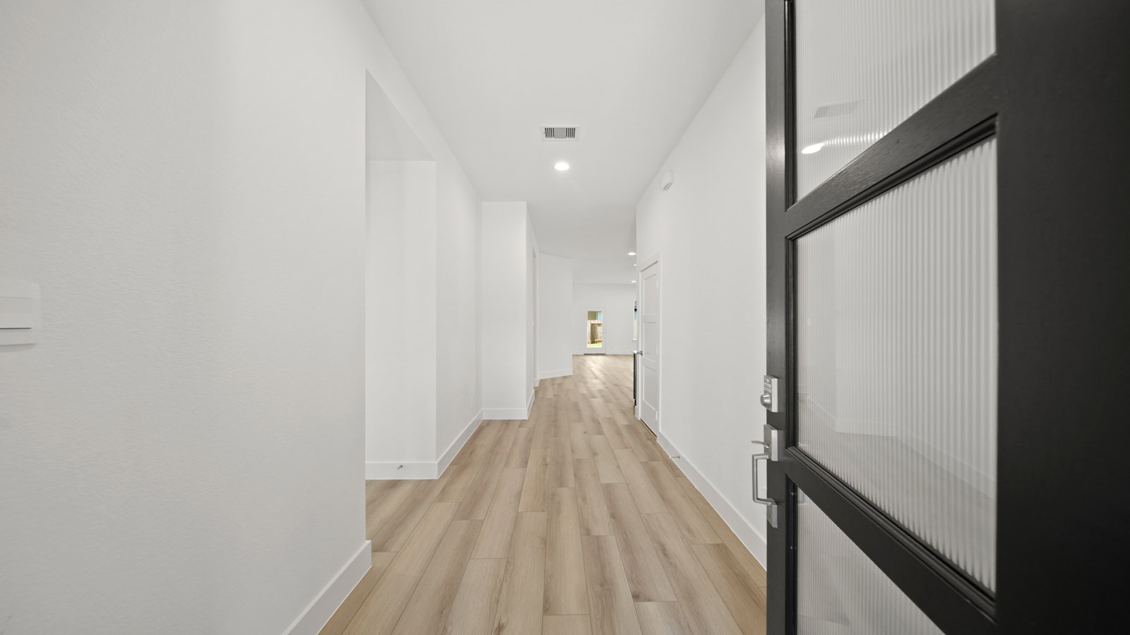 Entry hallway with vinyl flooring