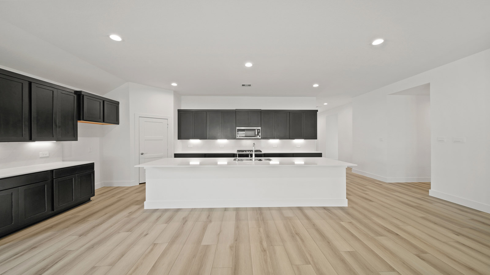 Open concept living, dining, and kitchen area