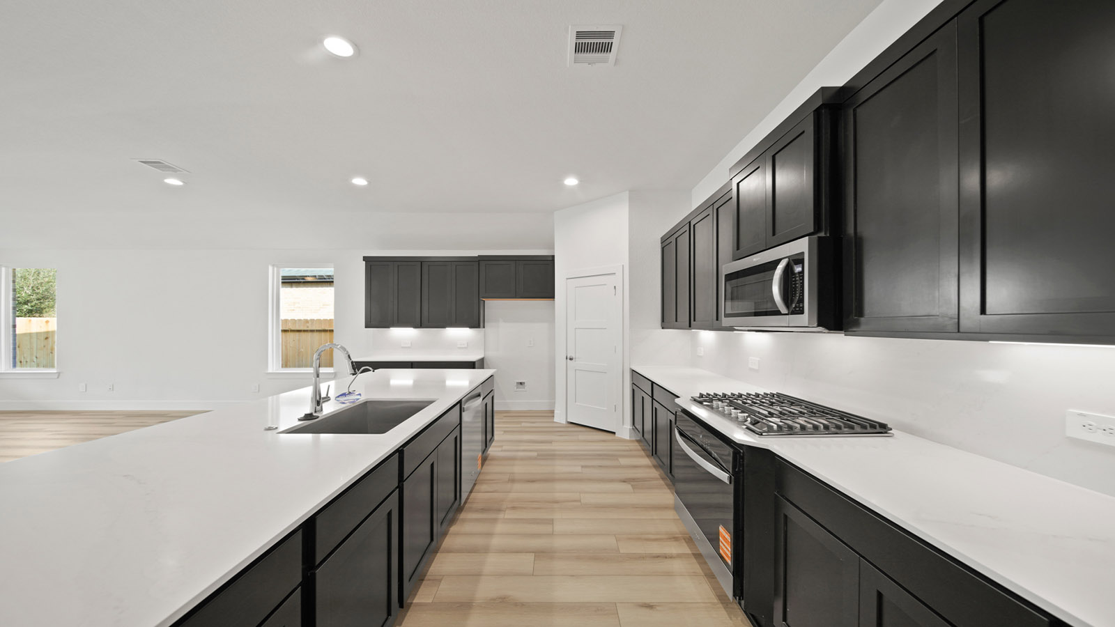 Open concept living, dining, and kitchen area