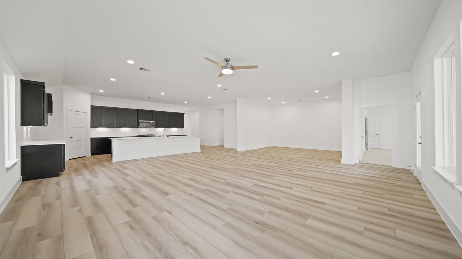 Open concept living, dining, and kitchen area