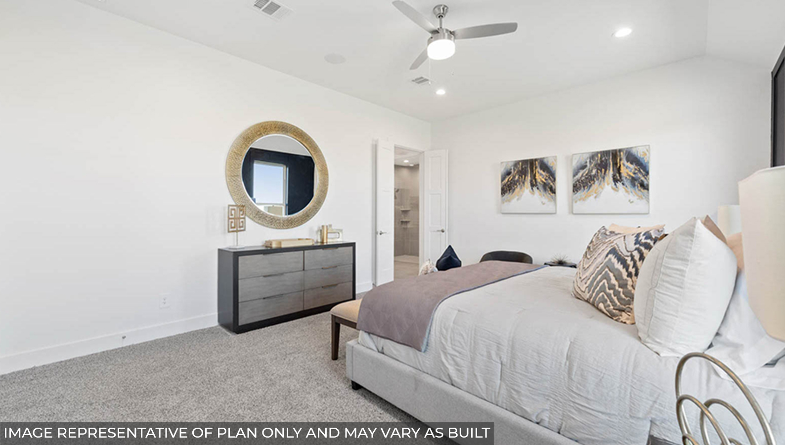 Primary bedroom with carpet flooring, a ceiling fan, and bright windows.