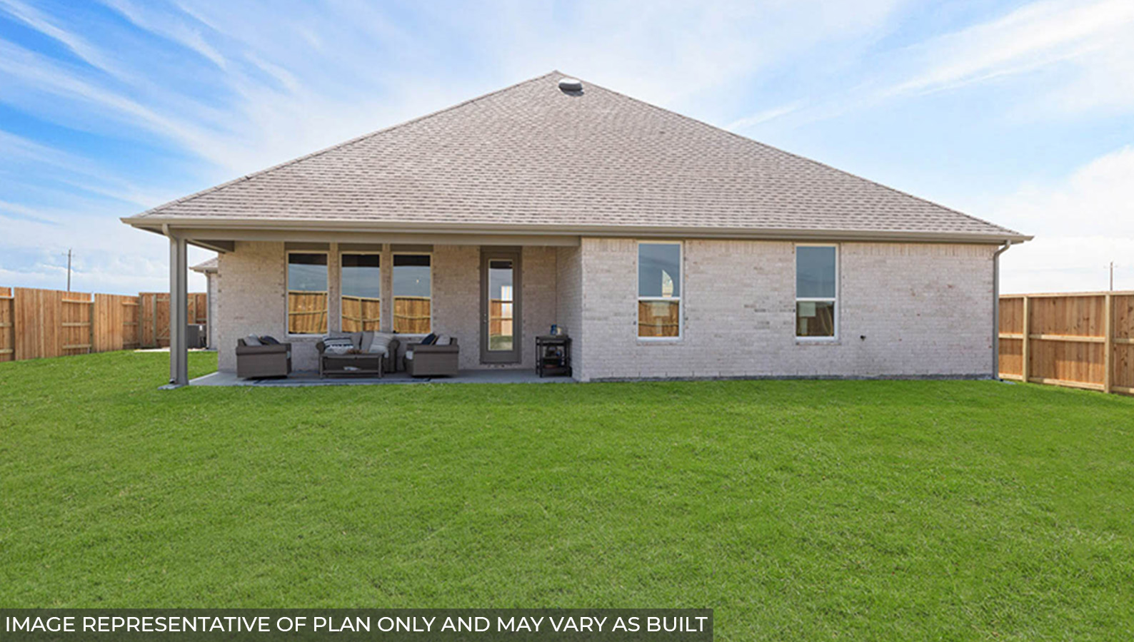 Spacious backyard with back patio and overhead lights.