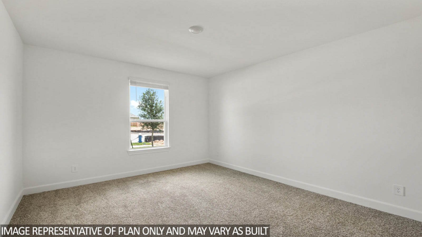 Secondary bedroom with carpet flooring