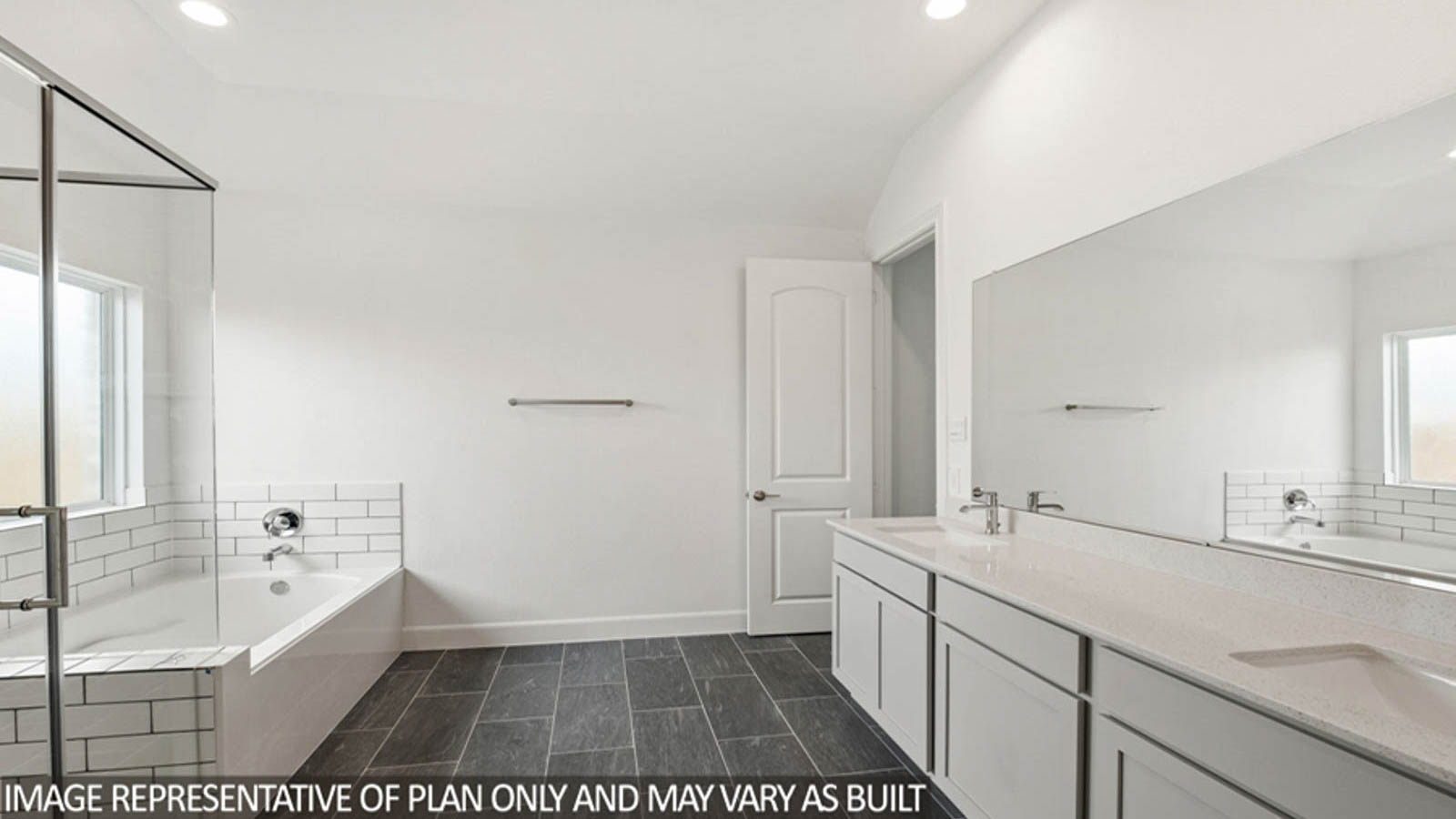 Primary bathroom with tub and shower