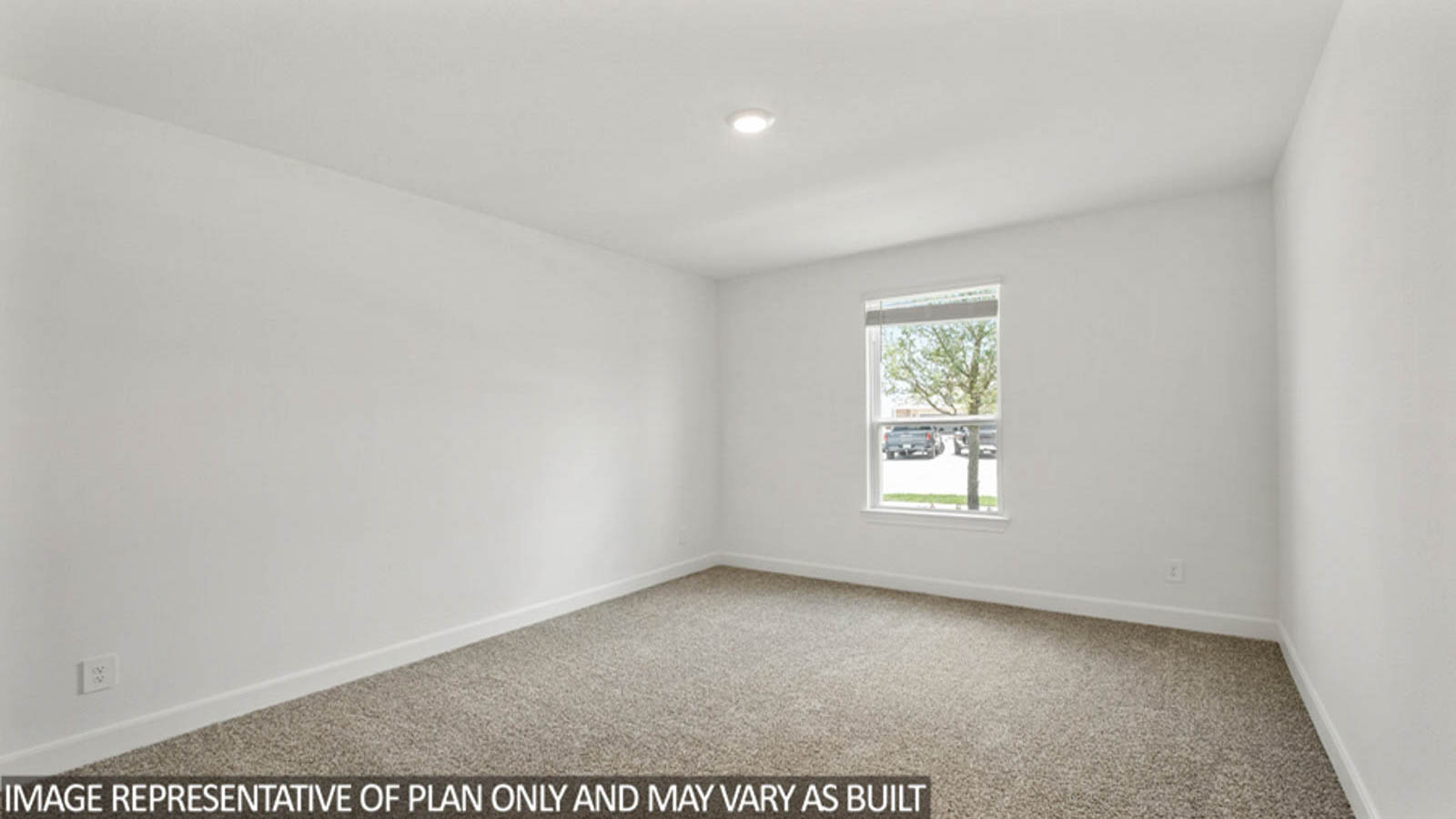 Secondary bedroom with carpet flooring