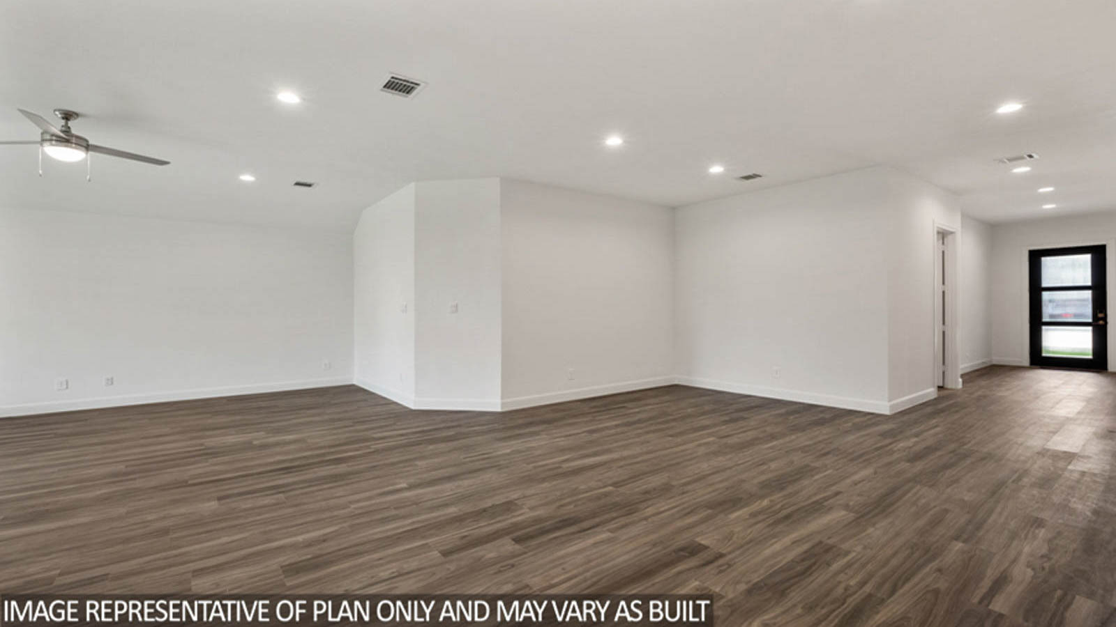 Open concept living and dining area with vinyl flooring and bright windows.