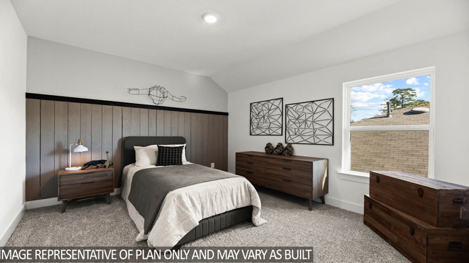 Secondary bedroom with carpet flooring