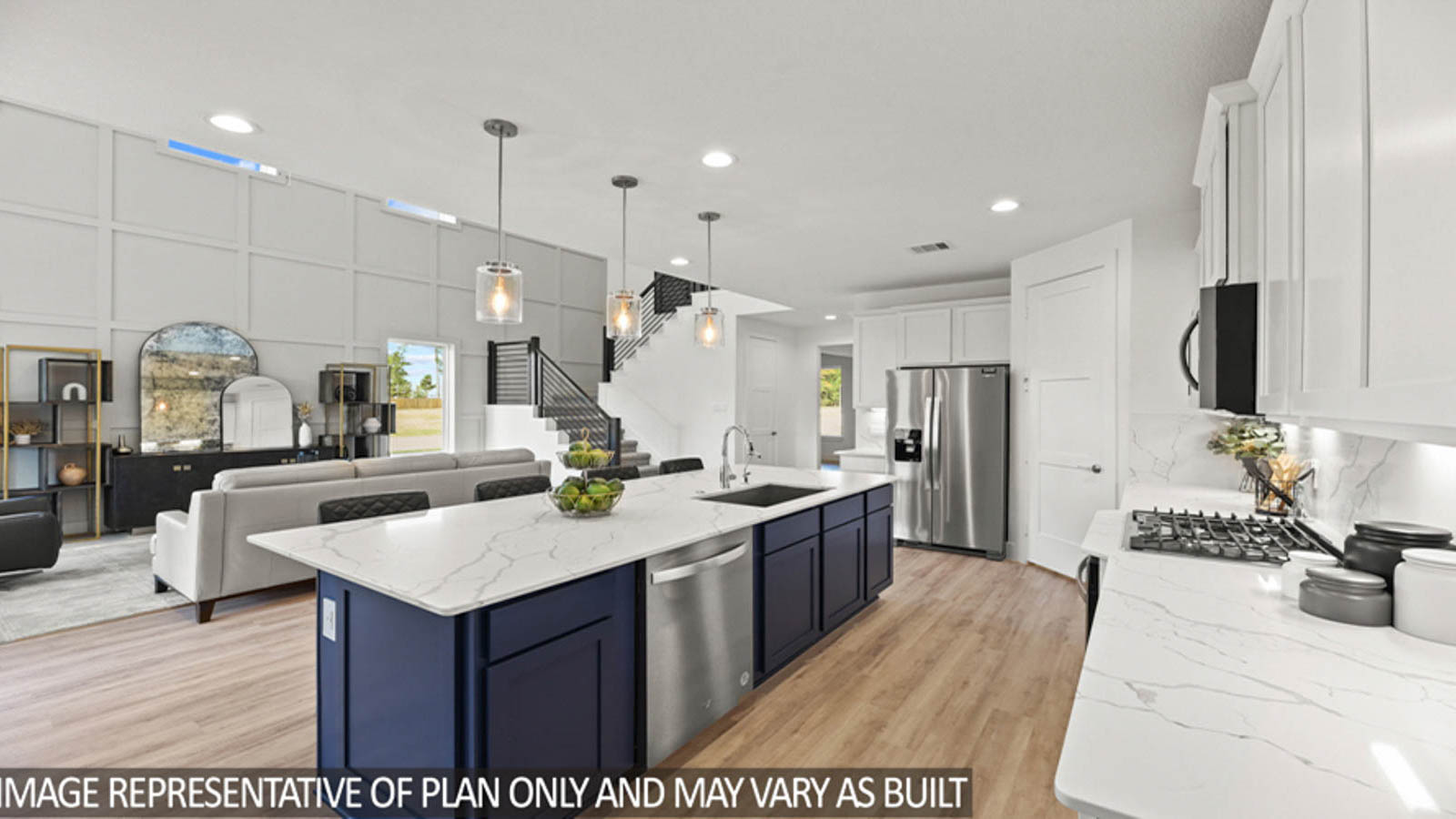Kitchen with and island and stainless-steel appliances.