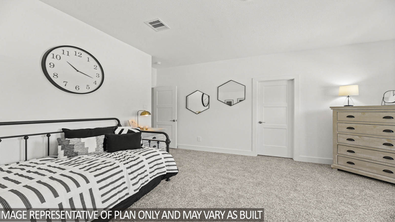 Secondary bedroom with carpet flooring and a bright window.