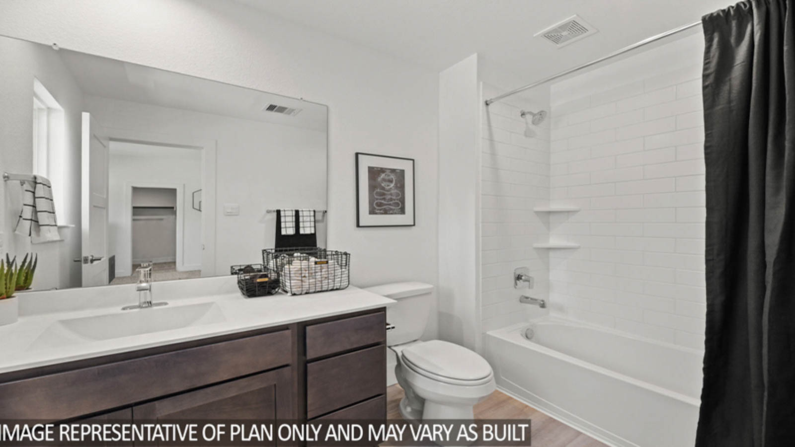 Secondary bathroom with vinyl flooring and a tile tub/shower combo.
