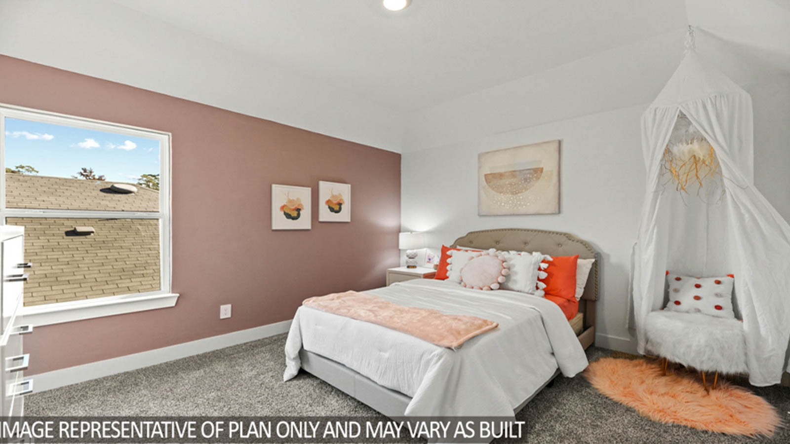 Secondary bedroom with carpet flooring and a bright window.