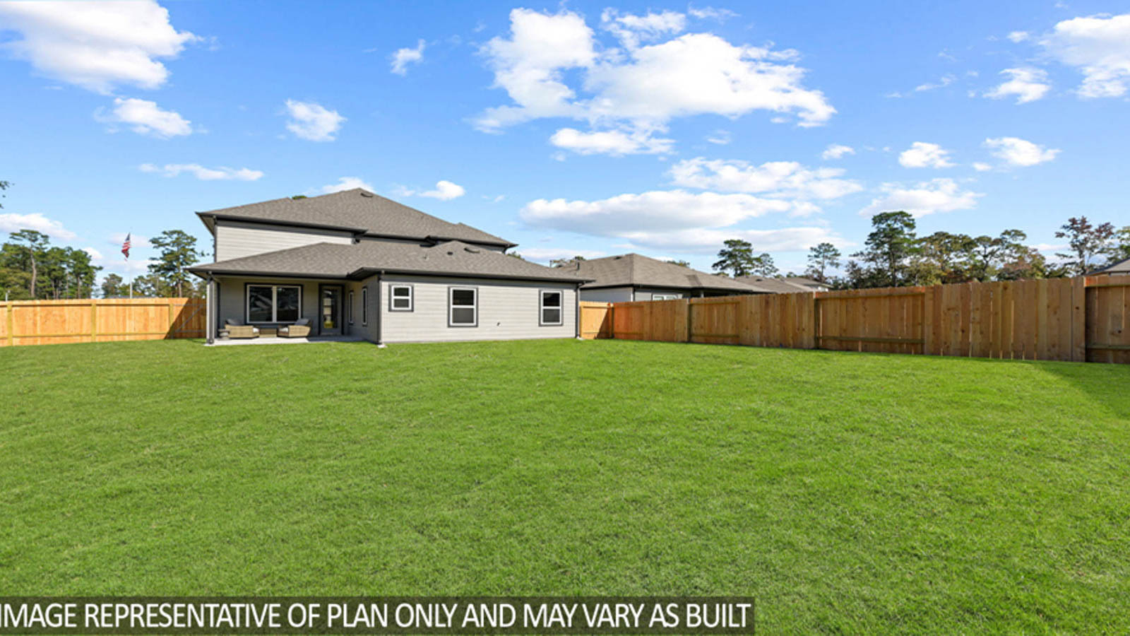 Spacious backyard with back patio and overhead lights.