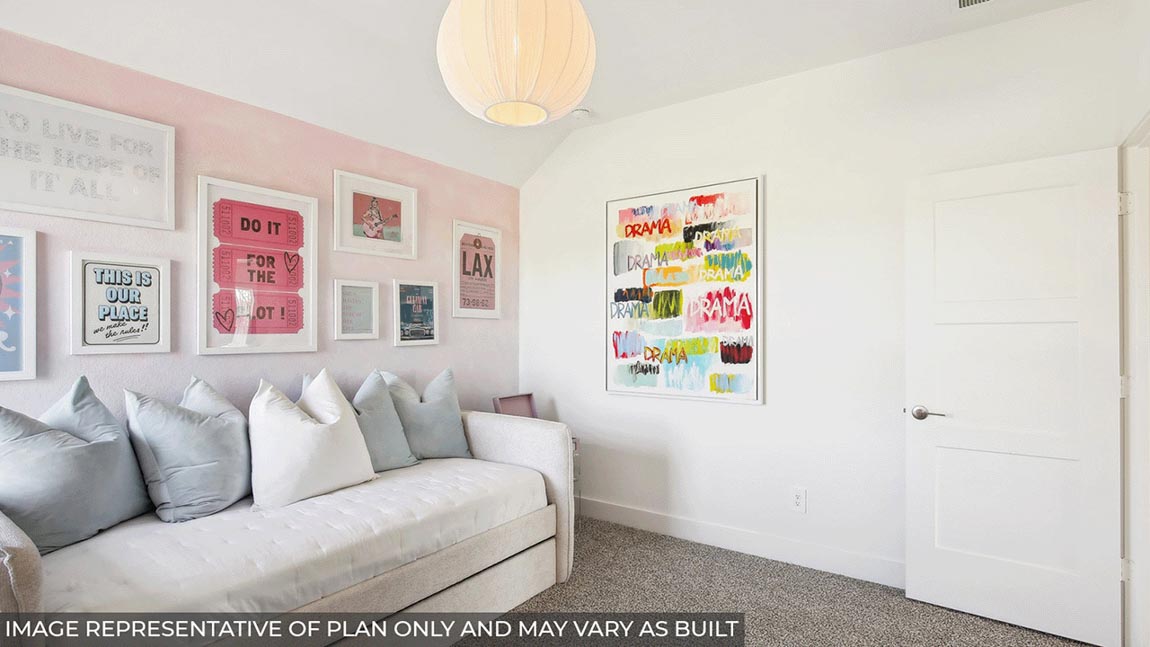 Secondary bedroom with carpet flooring