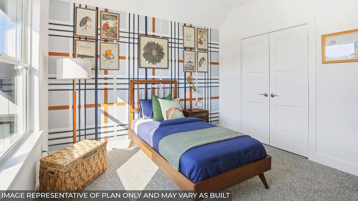 Secondary bedroom with carpet flooring