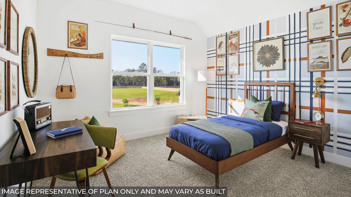 Secondary bedroom with carpet flooring