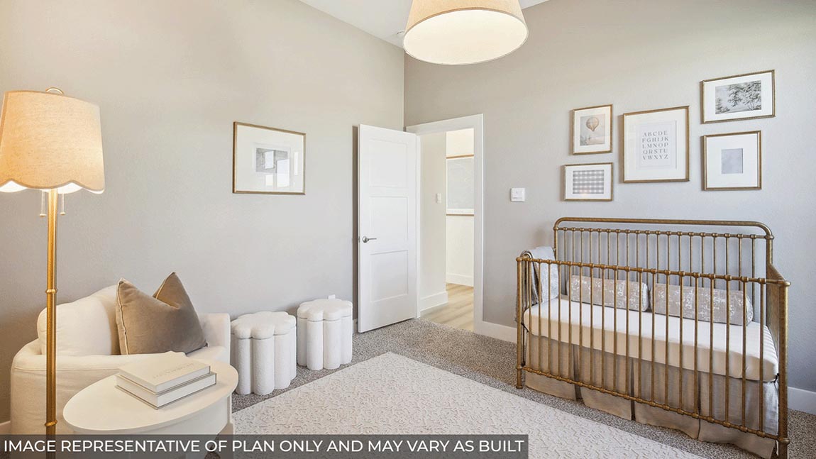 Secondary bedroom with carpet flooring
