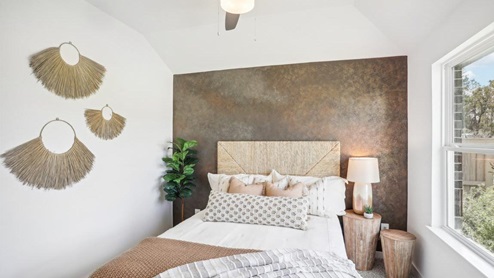 Secondary bedroom with carpet flooring