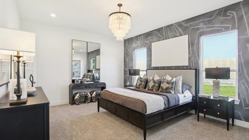 Primary bedroom with carpet flooring