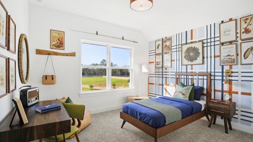 Secondary bedroom with carpet flooring