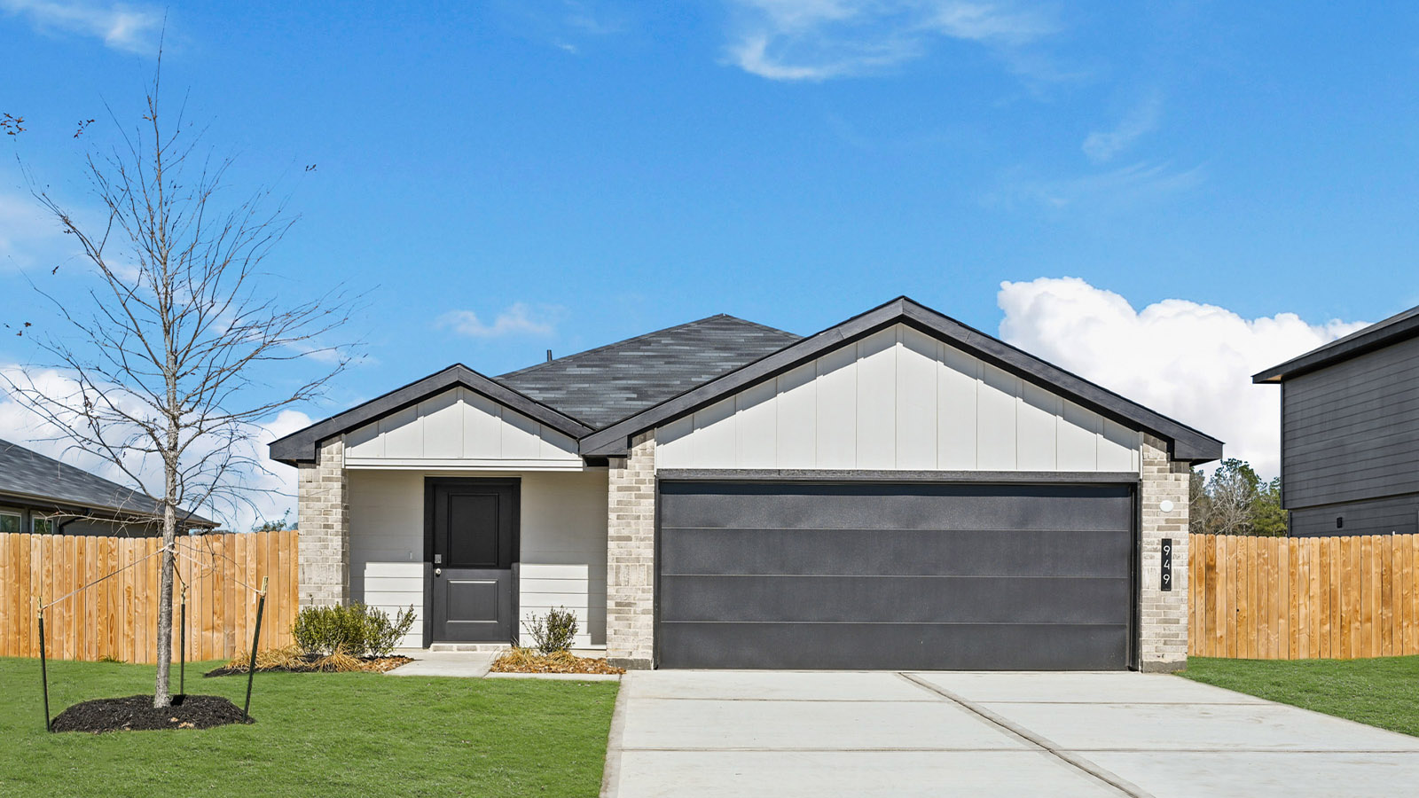 Single-story home with white trim and a two-car garage.