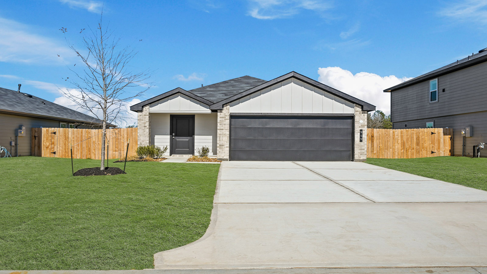 Single-story home with white trim and a two-car garage.