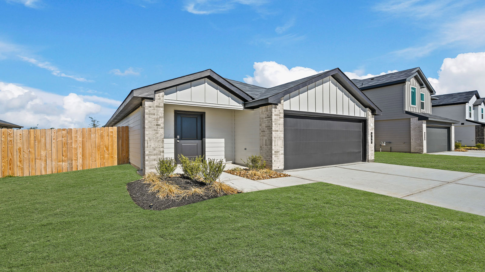 Single-story home with white trim and a two-car garage.