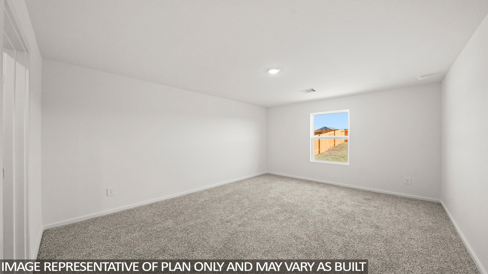 Primary bedroom with bright windows