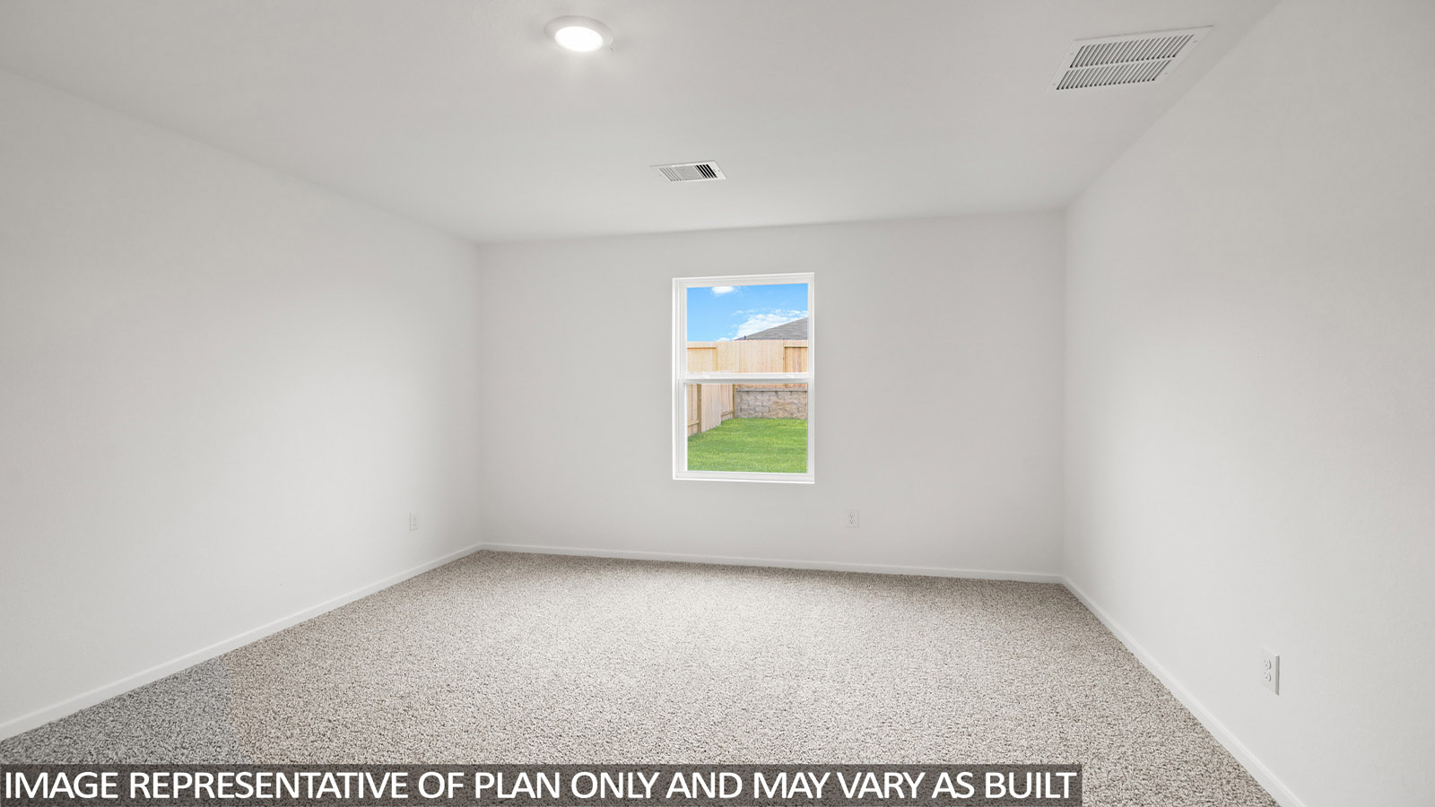 Primary bedroom with carpet flooring