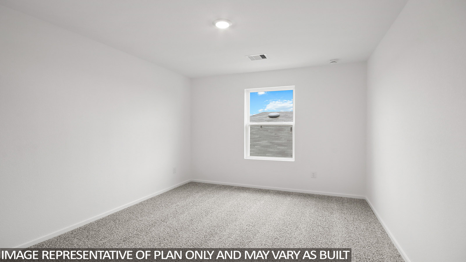 Secondary bedroom with carpet flooring