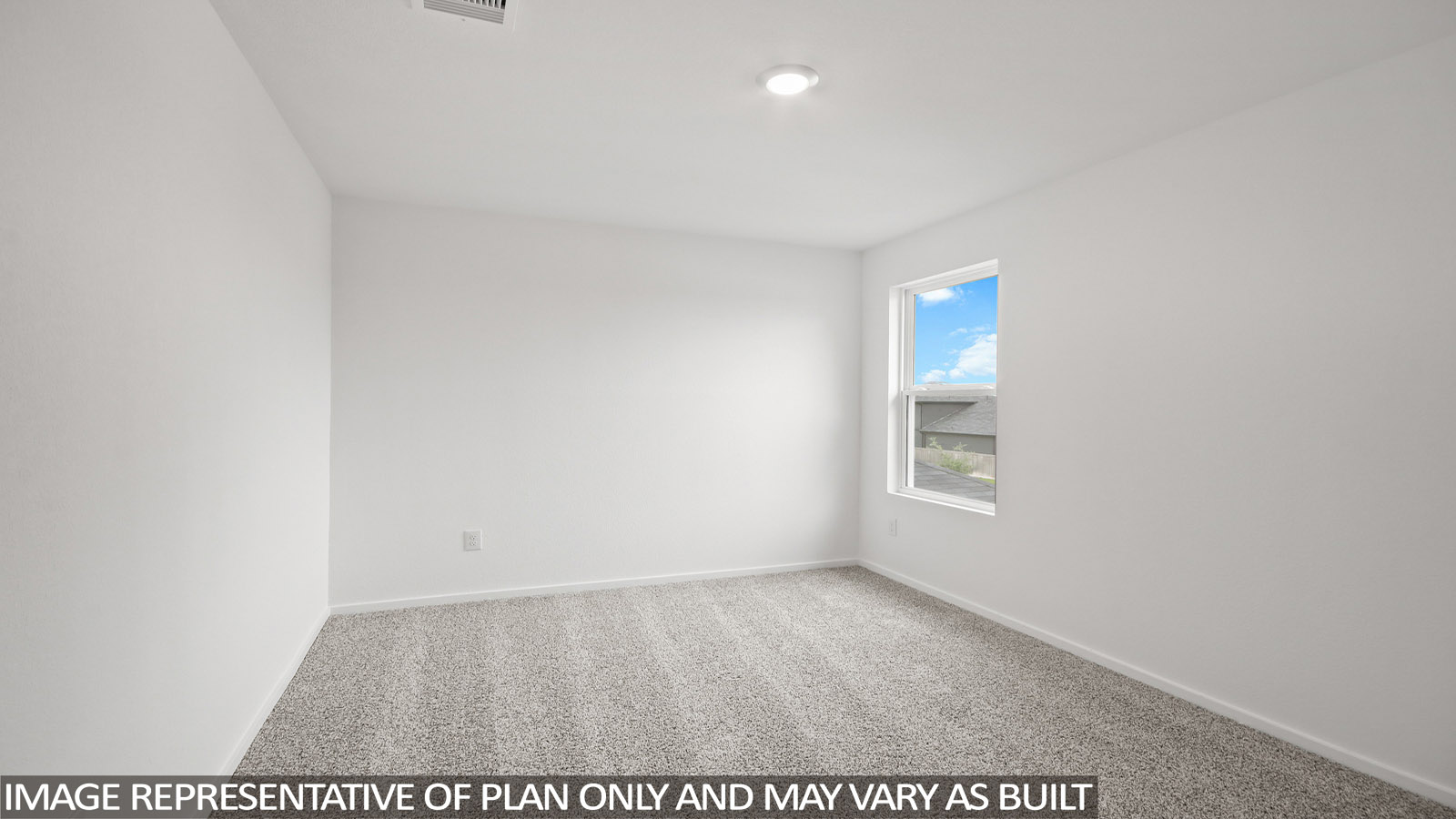 Secondary bedroom with carpet flooring