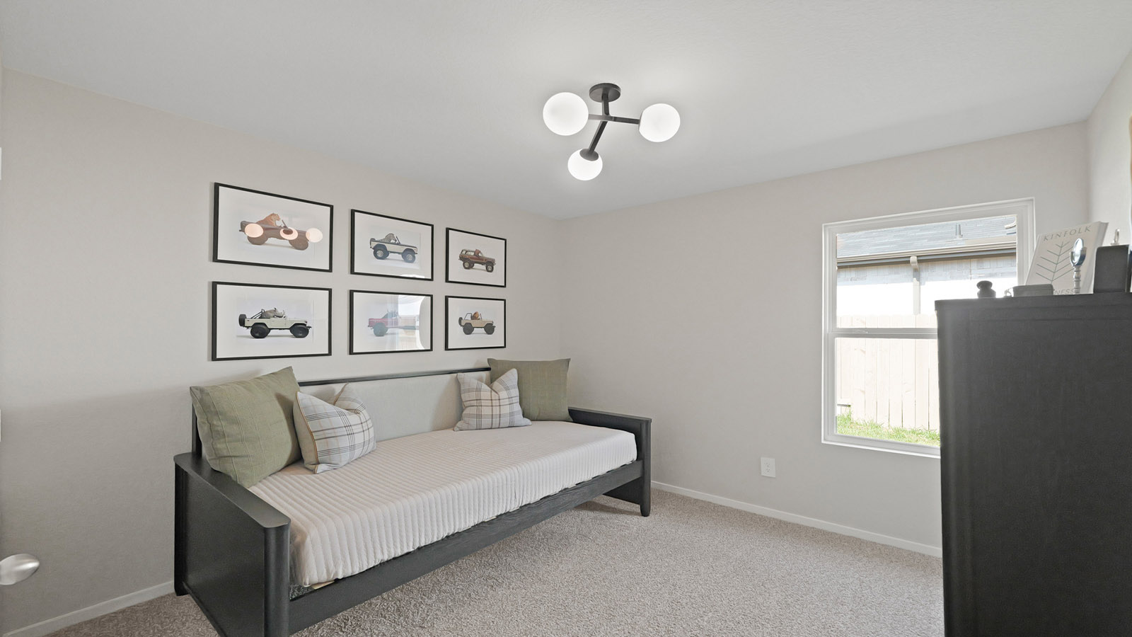 Secondary bedroom with carpet flooring