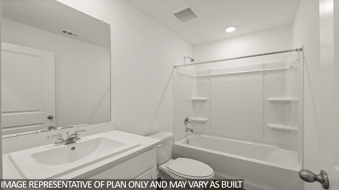 Secondary bathroom with a tile tub/shower combo.