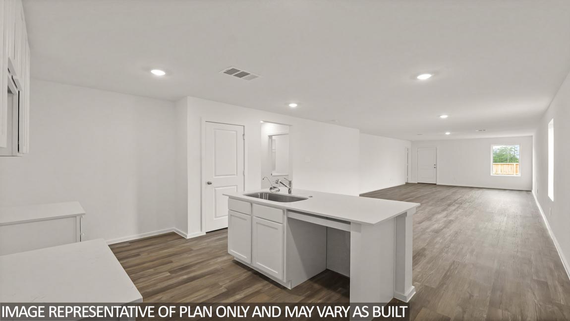 Open concept living and dining area with vinyl flooring and bright windows.