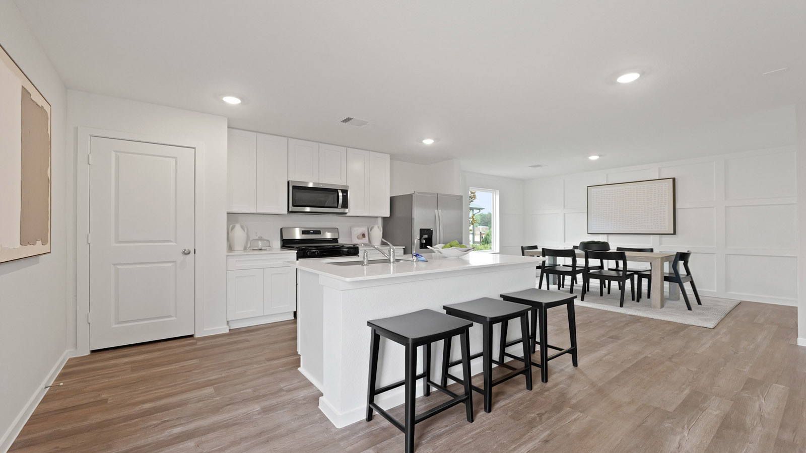 Kitchen with an island and stainless-steel appliances.
