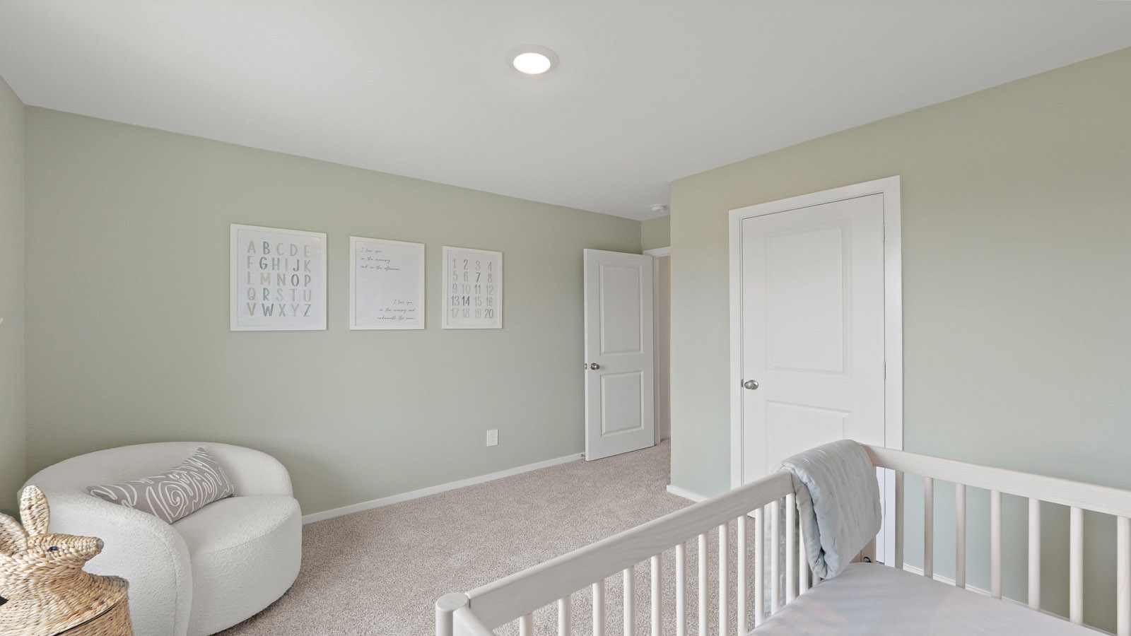 Secondary bedroom with carpet flooring and a bright window.