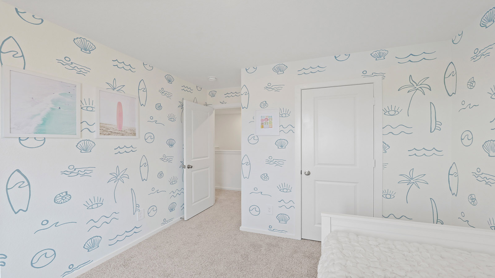 Secondary bedroom with carpet flooring and a bright window.