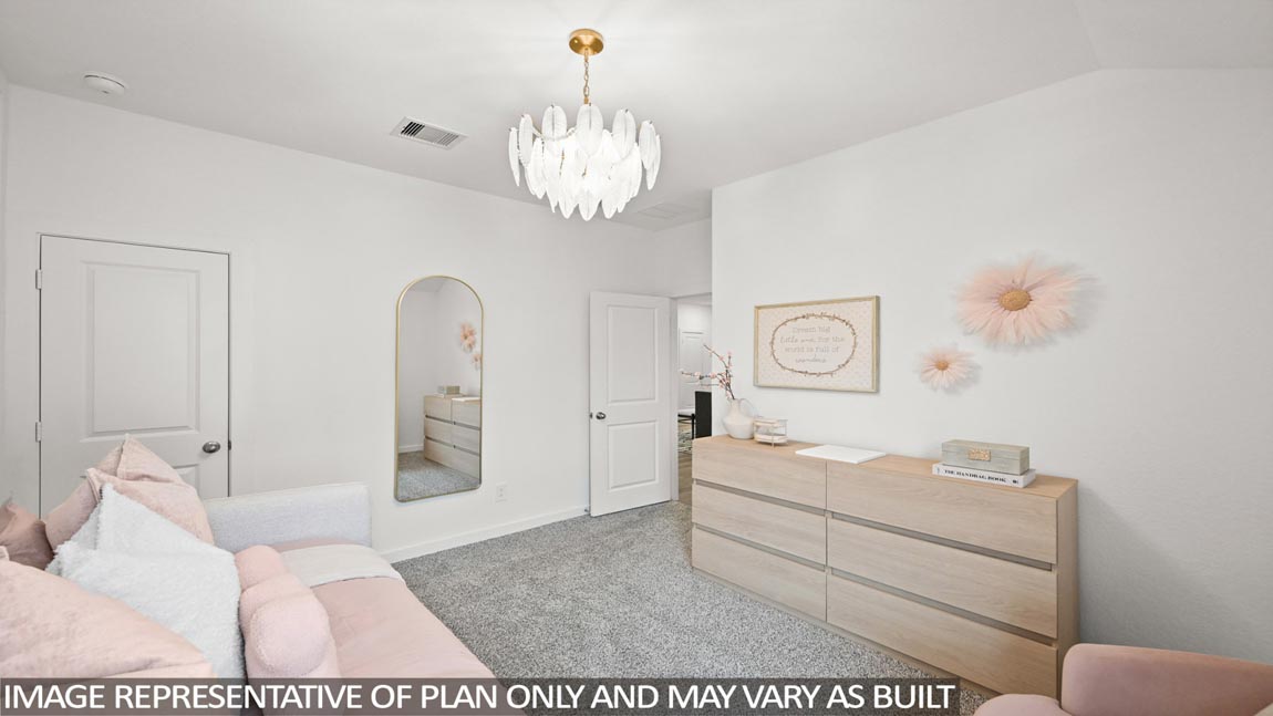 Secondary bedroom with carpet flooring